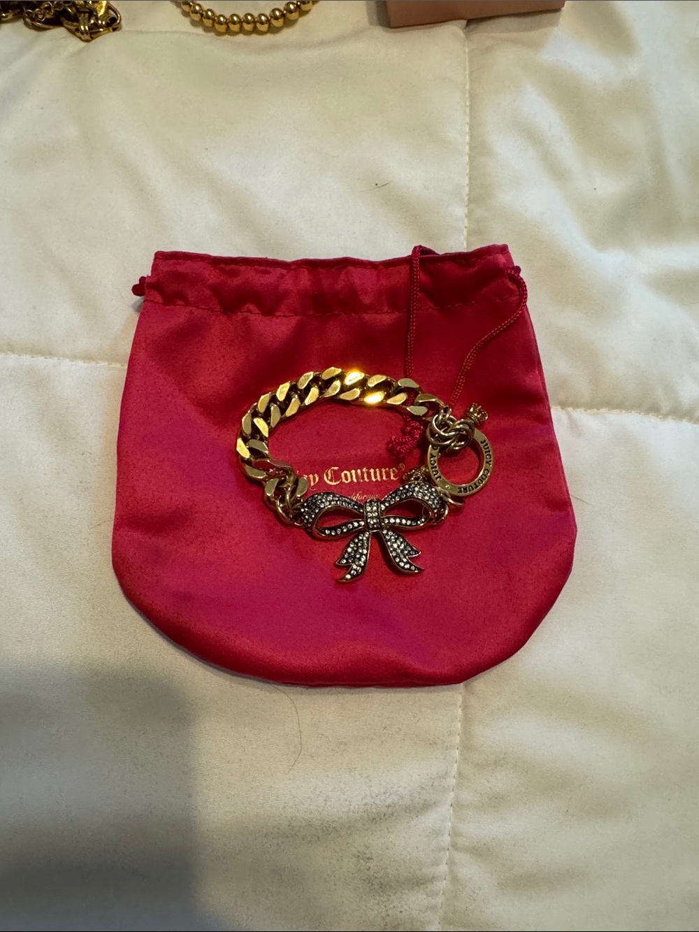 Juicy Couture Gold Tone Bow Charm Bracelet - Pink Pouch